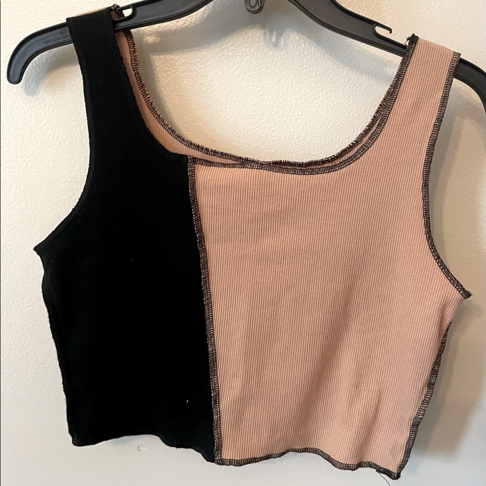 Black and tan crop top, backside all tan.